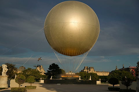The cauldron sits in the Tuileries garden on the final day of the 2024 Summer Olympics